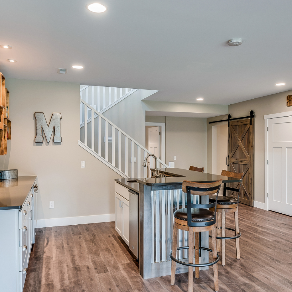 "Expertly finished drywall basement ceiling with smooth, durable surfaces and recessed lighting."